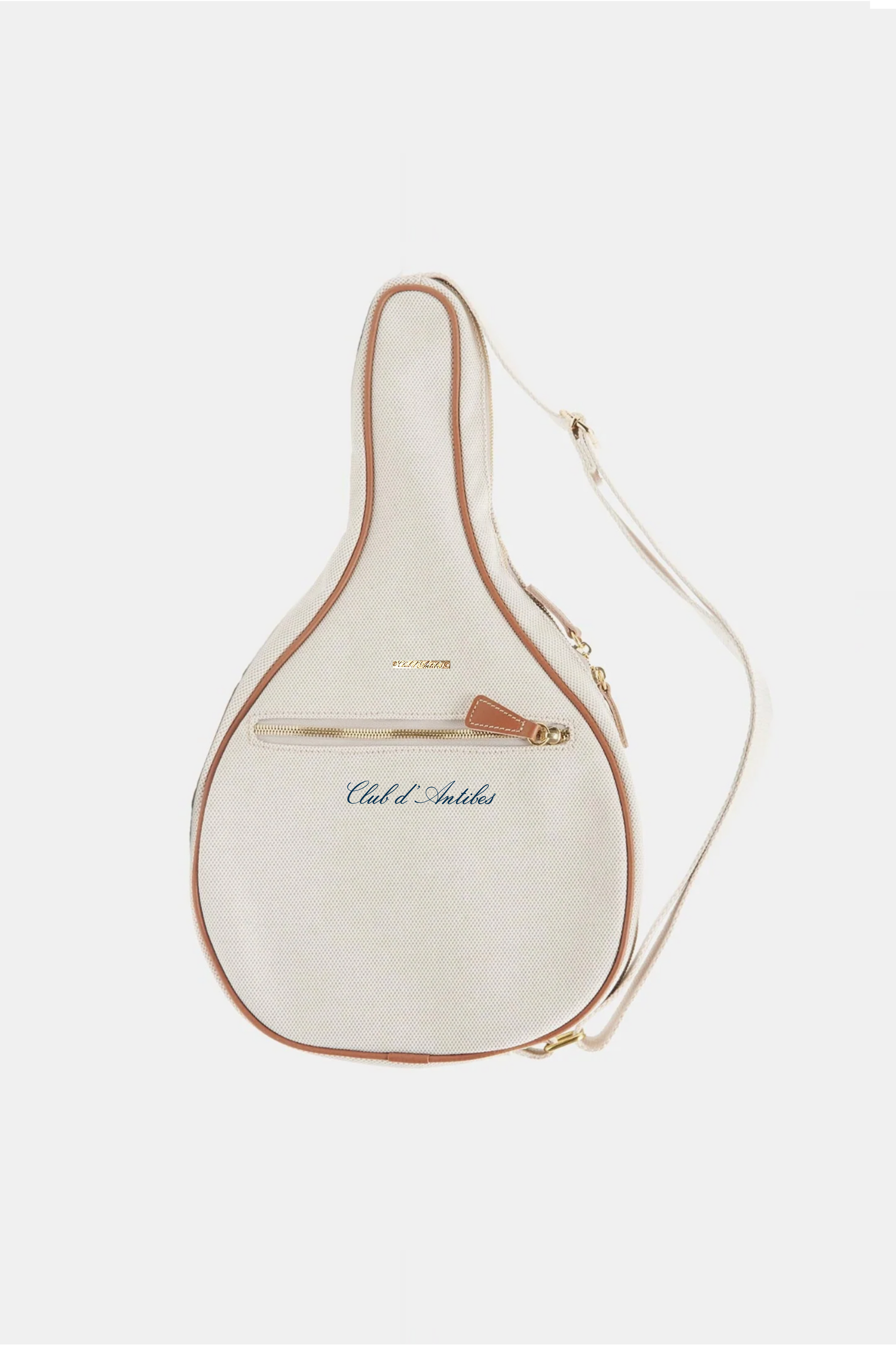 Cream-colored leather bag with gold trim on a white background